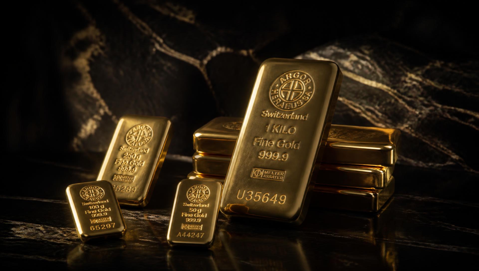 Swiss fine gold bullion bars on dark polished stone